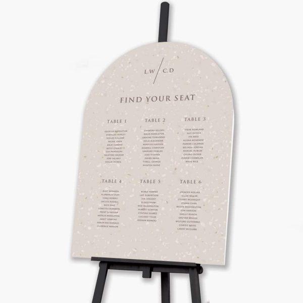 terrazzo wedding seating plan on black easel