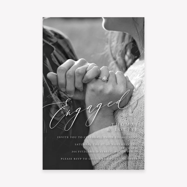 Engagement invitation with close up photo of couple's hands holding