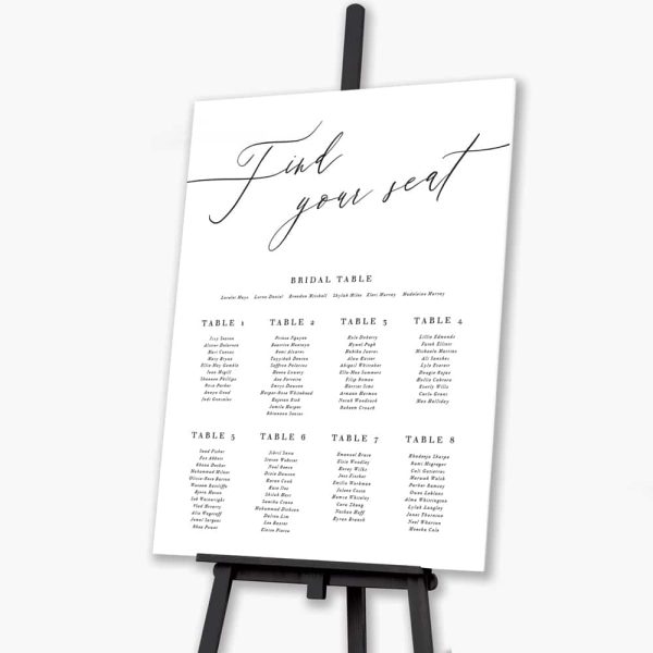 timeless script wedding seating plan on black easel