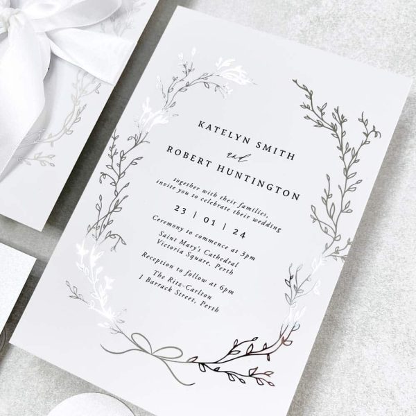 Delicate Wreath with silver foil and white satin bow wedding invitation