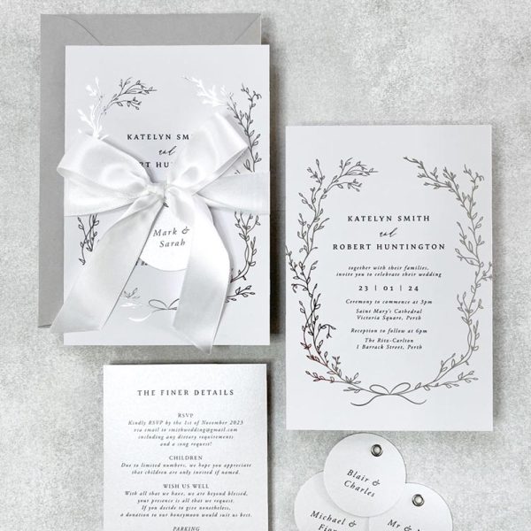 Delicate Wreath with silver foil and white satin bow wedding invitation