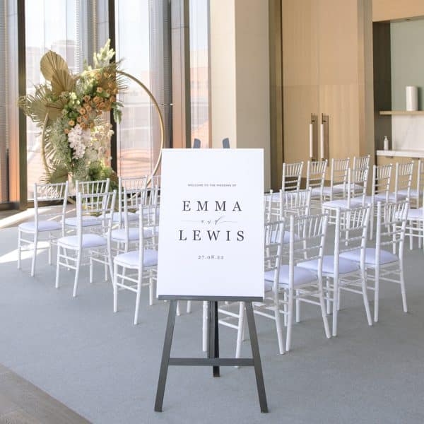 Grey stone welcome sign at wedding