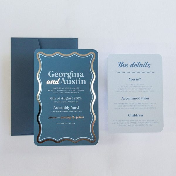 Electric Sky Wedding Invitation with blue background, silver foiled wave border and light sky blue details card
