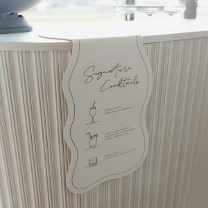Ombre noir hanging bar sign, hanging on front of white bar