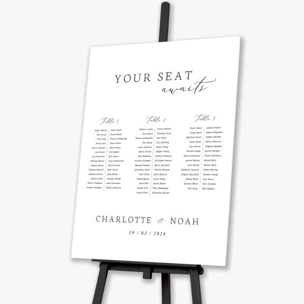 your seat awaits wedding seating plan sitting on black easel