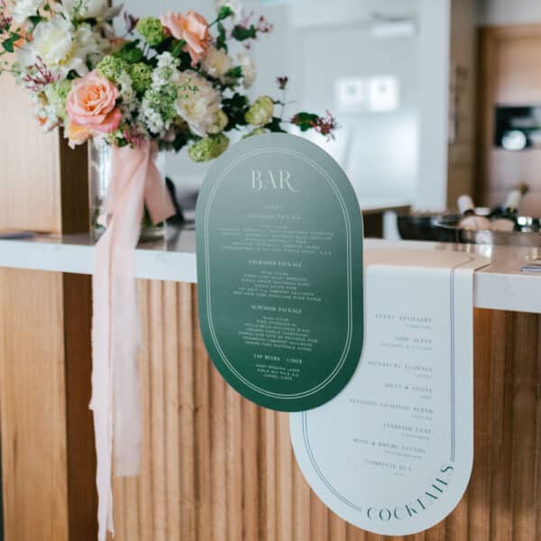 bar sign hanging next to floral bouquet