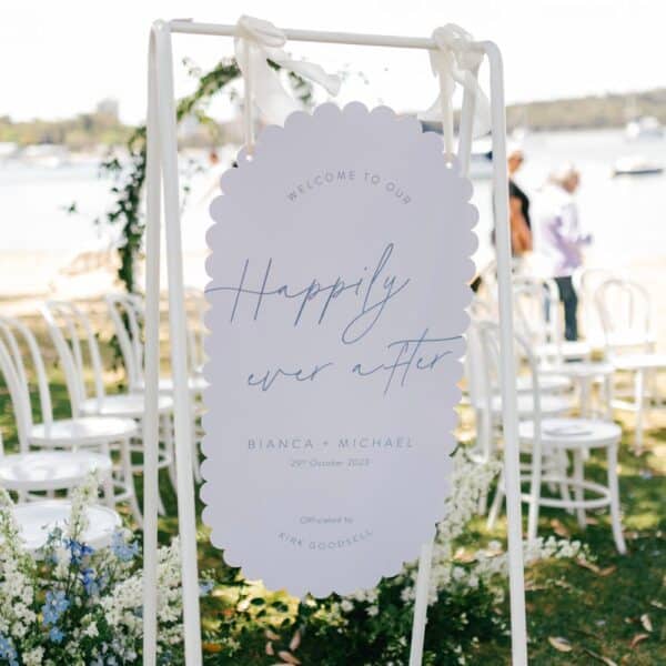 scalloped sky welcome sign photo at river