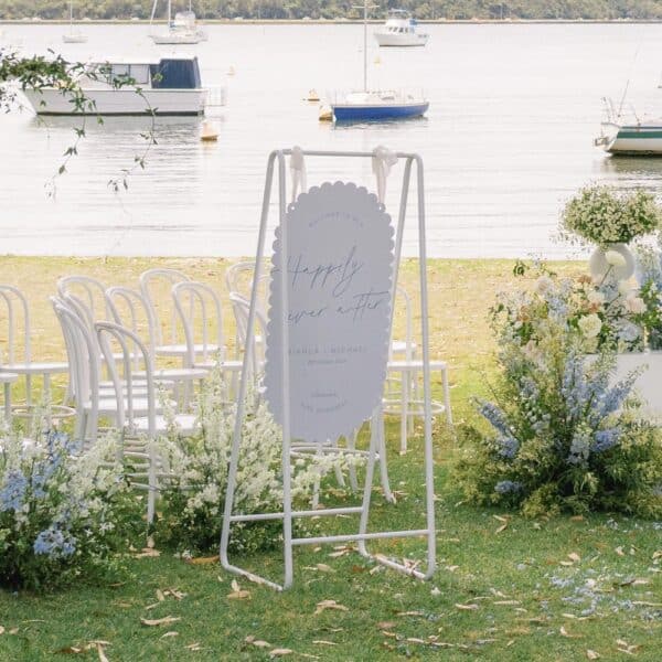 scalloped sky welcome sign photo at river