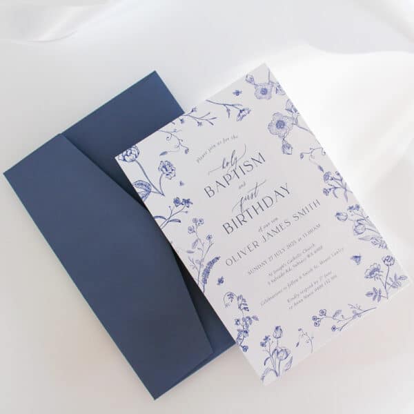 A baby's Baptism Invitation and First Birthday Invitation with blue delicate blossom flowers and soft fonts.